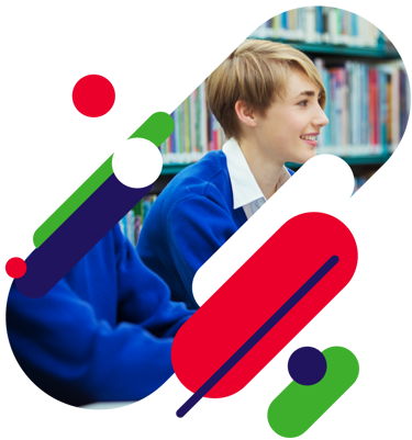 Close up of young person in school. There are lots of books in the background.